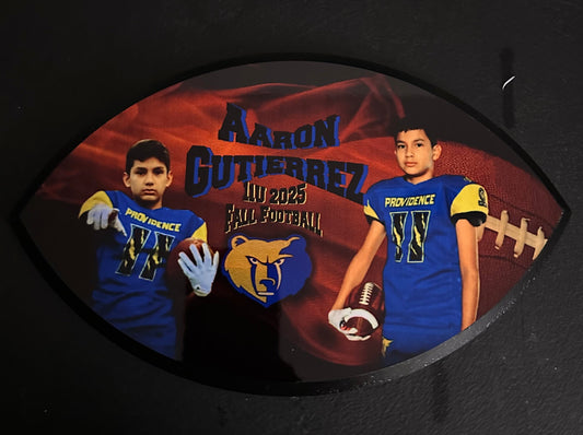 Decorative plaque with a football player design on a dark background
